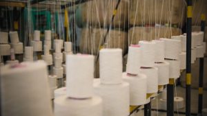 Reams of white cotton ready for the sewing machine to make school uniforms