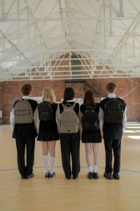 children with back to camera in uniform