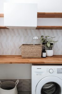 washing machine with basket plants on top